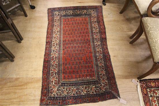 Persian red ground rug(-)